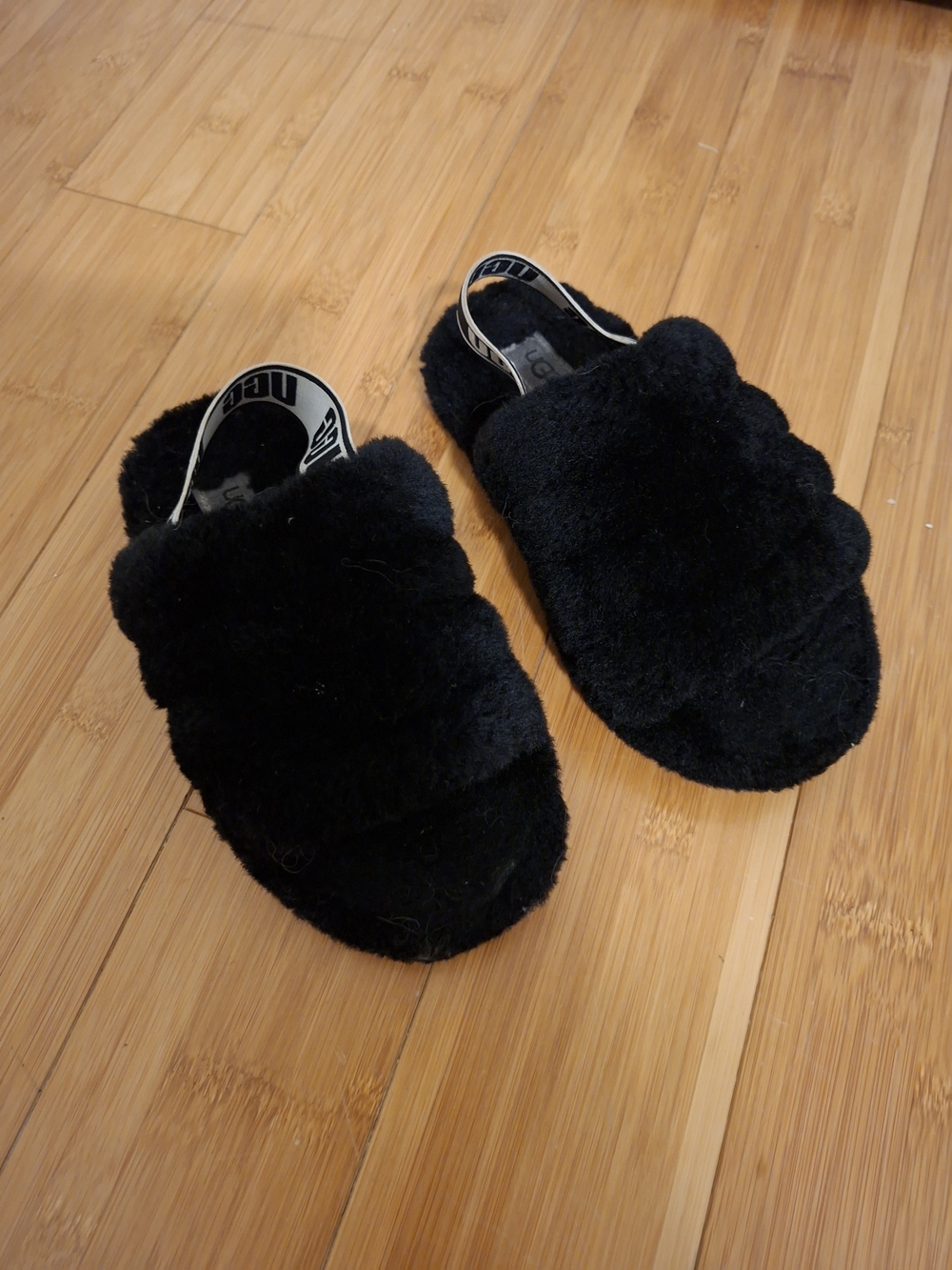 UGG Kids Black Fuzzy Slide Slippers with Branded Heel Strap